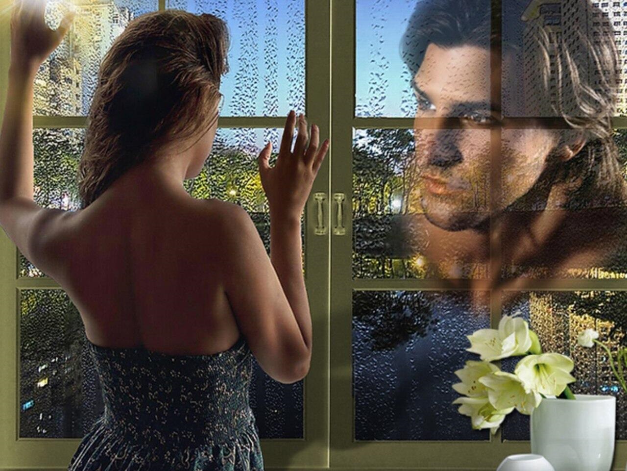 Мужчина и женщина у окна